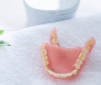 a pair of dentures on a towel
