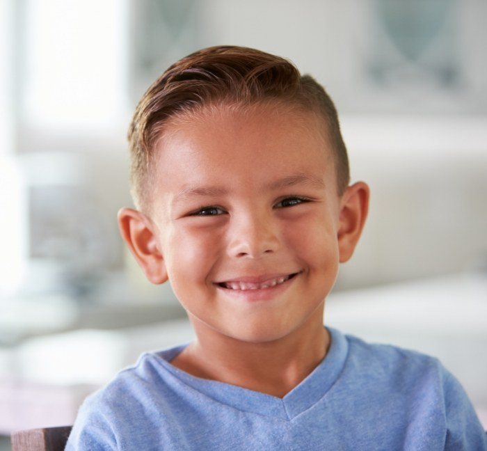 Young boy smiling after children's dentistry in Waverly