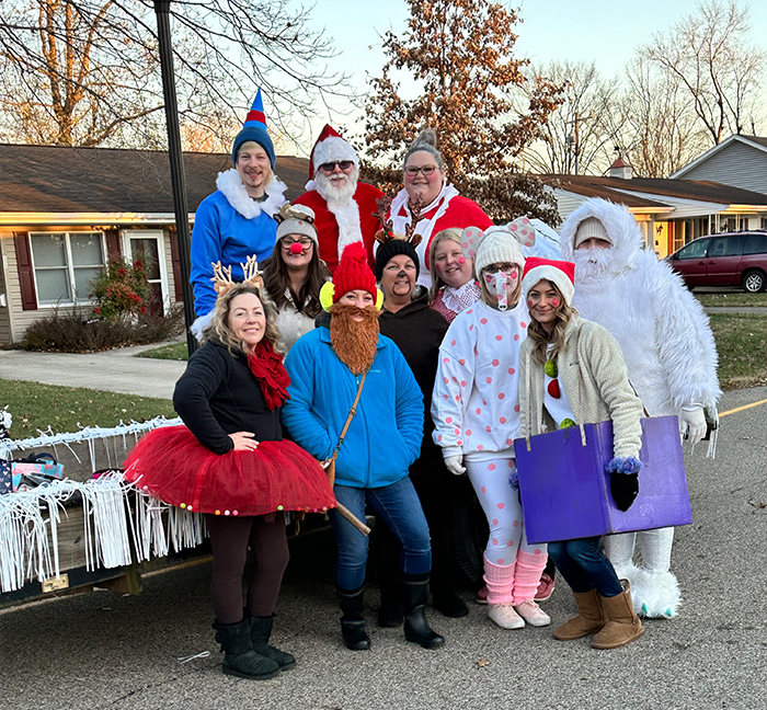 Dental team members in festive holiday clothing