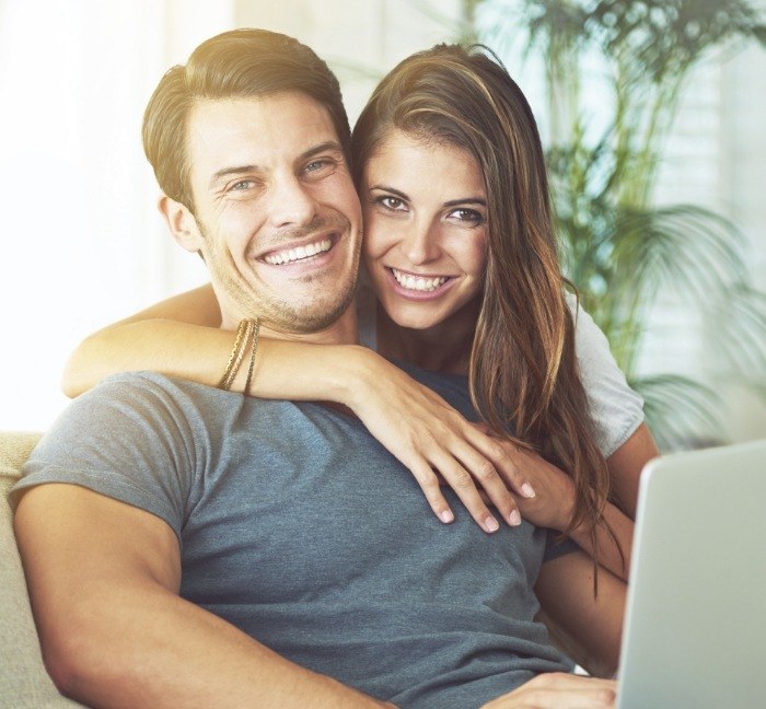 Man and woman smiling after cosmetic dentistry in Waverly