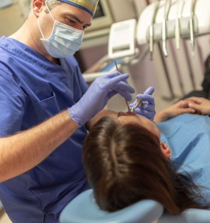 Dentist examining a woman's teeth