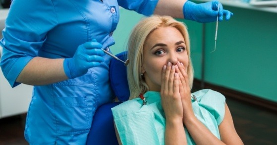 Woman looking scared in dental chair