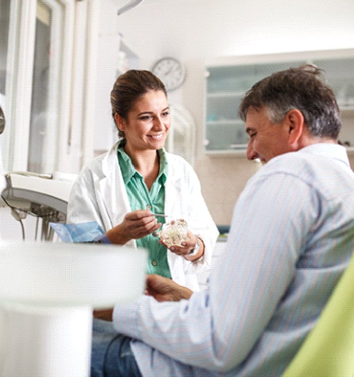 Dentist talking to a patient