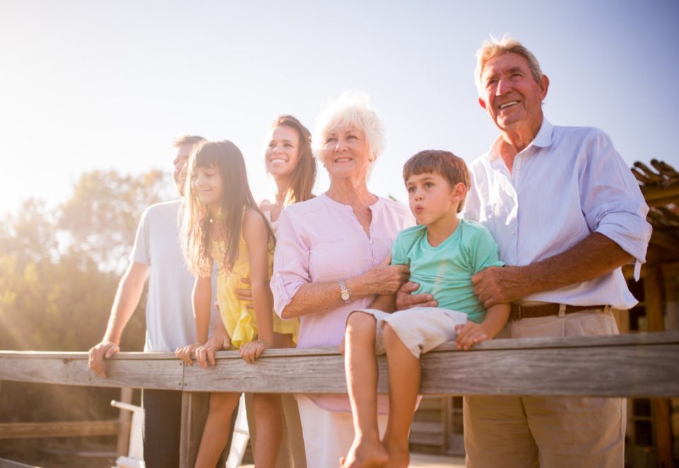 Family of six smiling outdoors after visiting dentist in Waverly Ohio