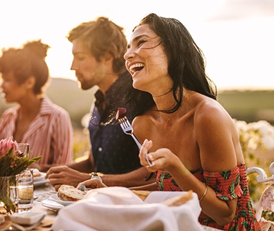 Woman enjoying a meal with friends