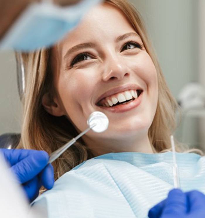 Patient smiles at dentist