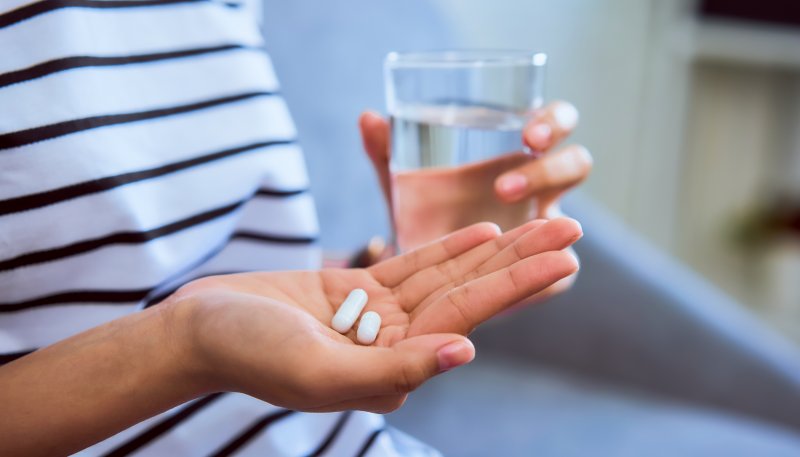 Lady prepares to take pain medication